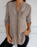 Paneled sequin button casual top